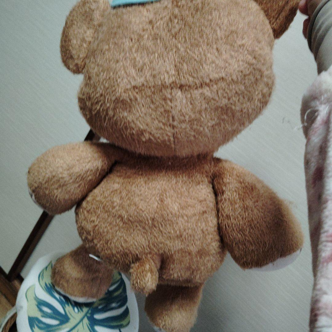 茶色いクマのぬいぐるみ 青い帽子付き